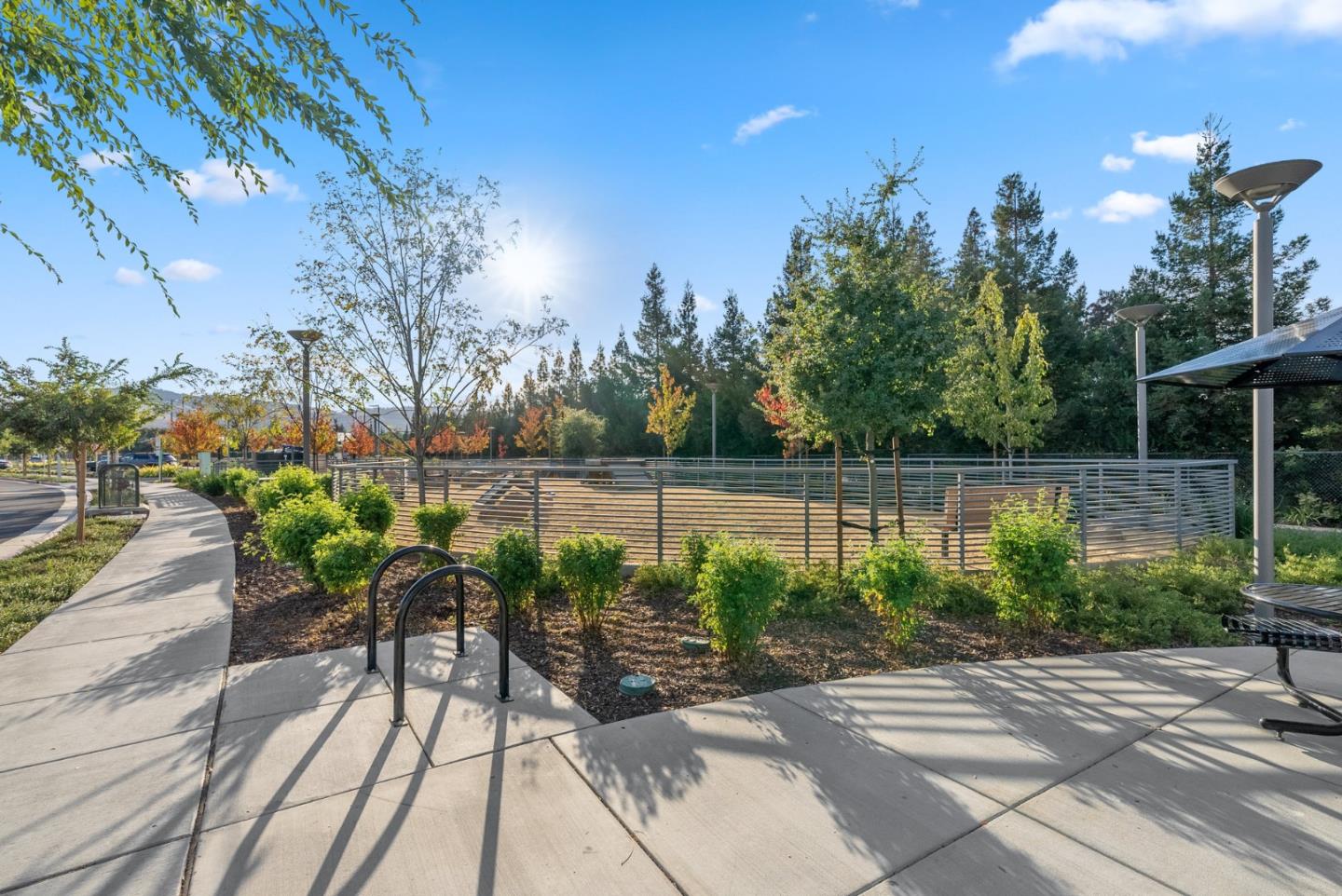 6725 Magnetic Loop San Jose, CA 95119 - Photo 55 of 68 a view of a lake with a bench in patio