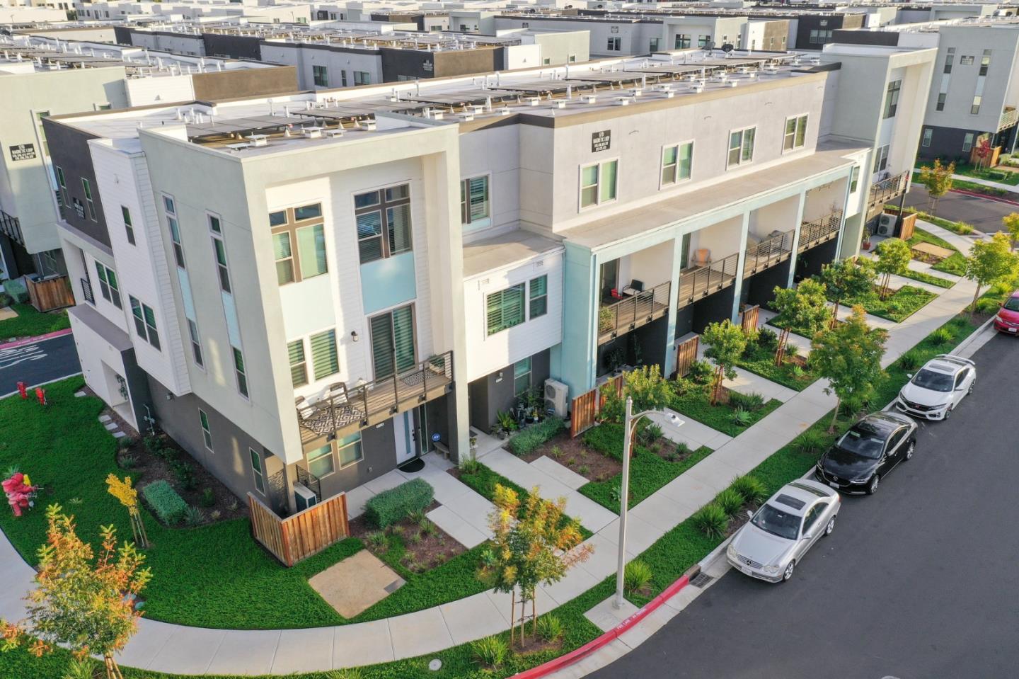 6725 Magnetic Loop San Jose, CA 95119 - Photo 57 of 68 a view of a large building with a swimming pool and outdoor seating