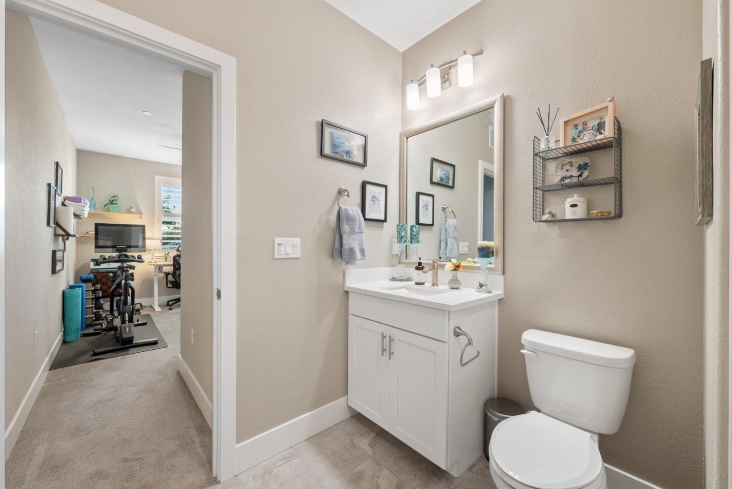 6725 Magnetic Loop San Jose, CA 95119 - Photo 8 of 68 a bathroom with a toilet sink and mirror