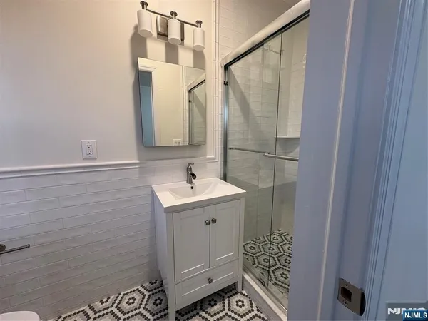 a bathroom with a sink and mirror