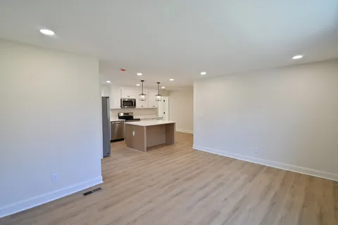 a view of kitchen with wooden floor