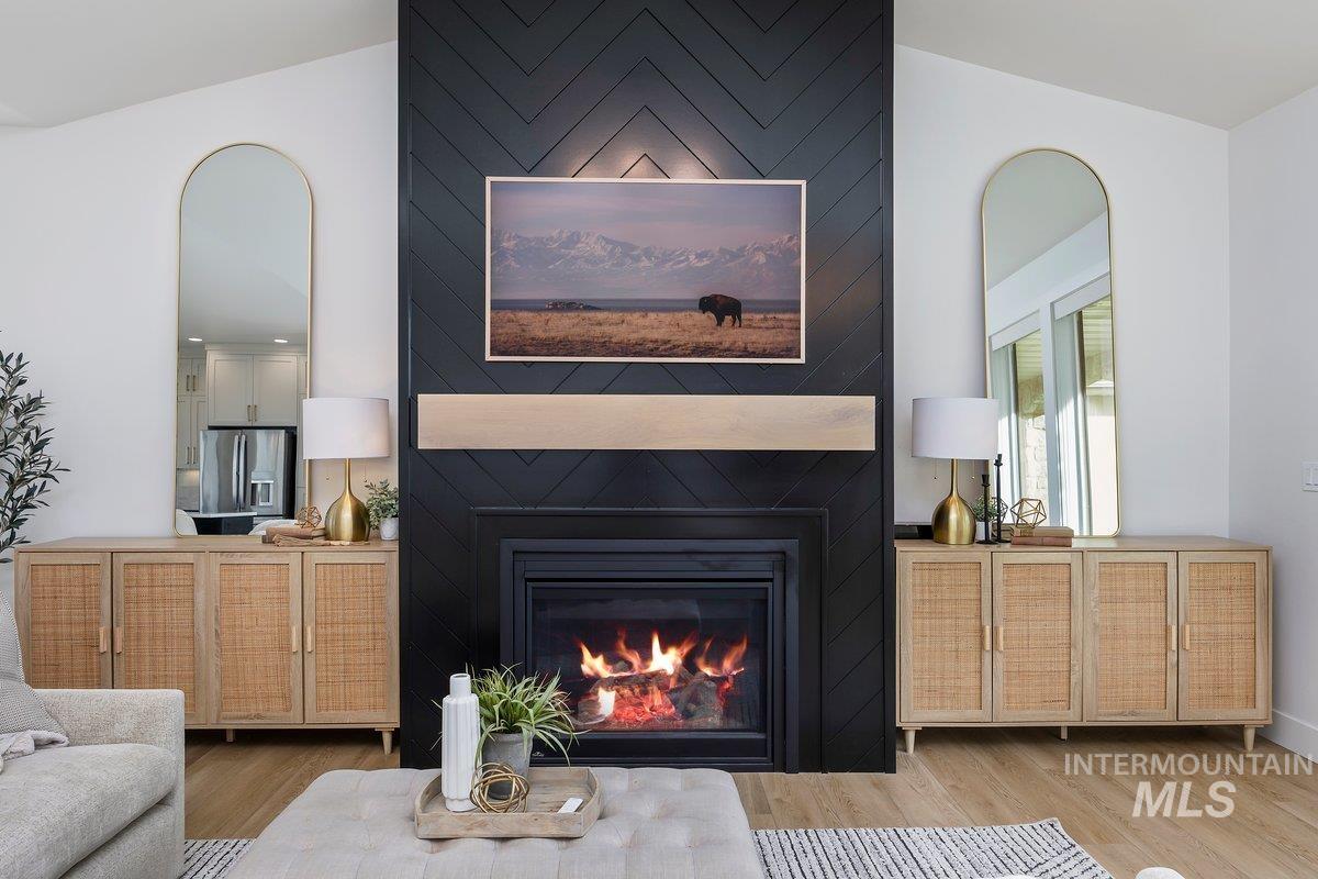 1046 Northridge Way Kimberly, ID 83341 - Photo 3 of 24 Living room featuring a large fireplace and wood finished floors