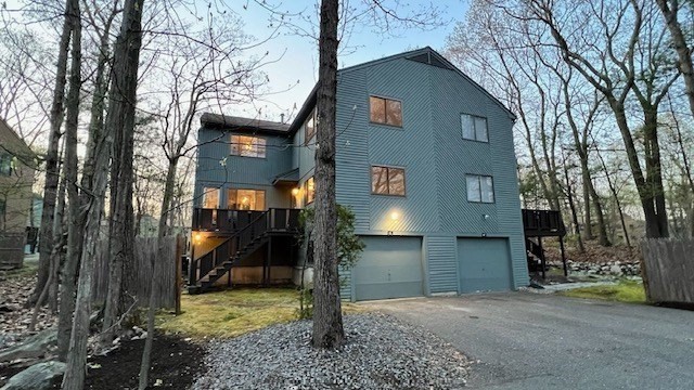 65 Mountain Gate Road, Unit 65 Ashland, MA 01721 - Photo 1 of 32 a view of a house with a yard
