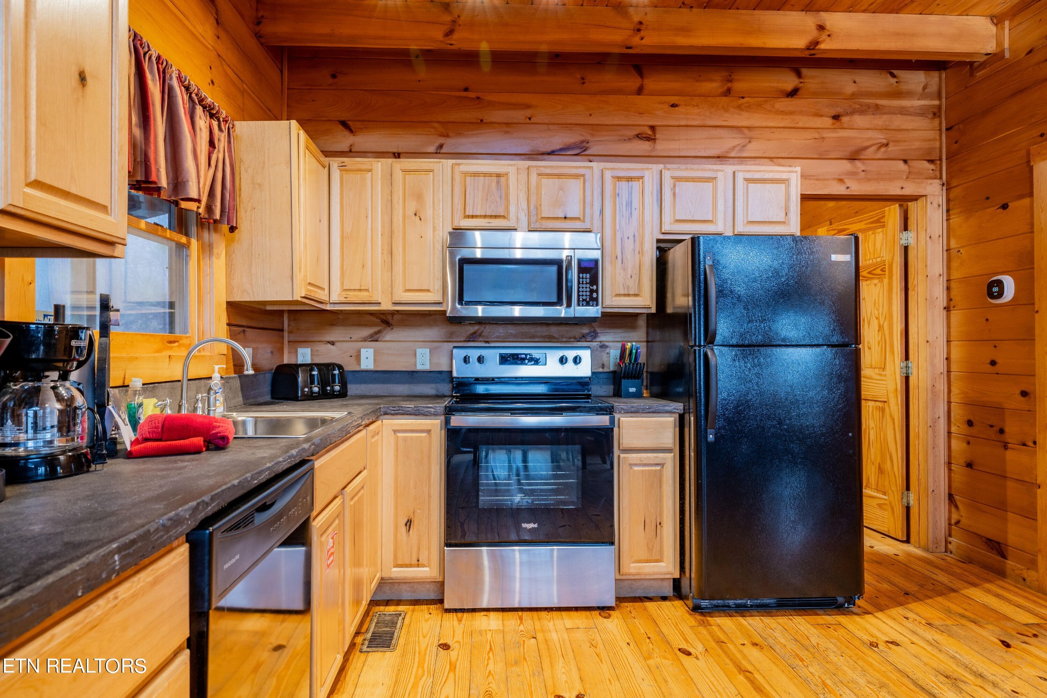 2149 Rising Fawn Way Sevierville, TN 37862 - Photo 25 of 50 a kitchen with stainless steel appliances granite countertop a refrigerator and a sink