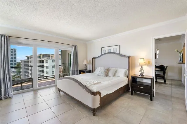 a large bedroom with a bed and walk in closet