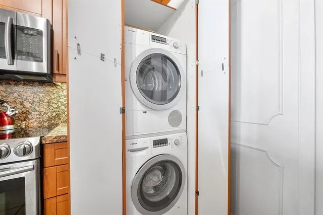 a view of a hallway with washer and dryer