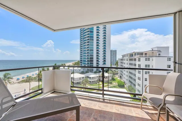 a view of a balcony with chairs