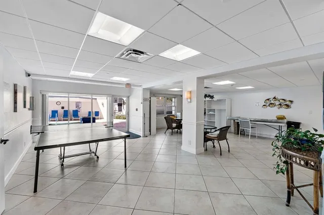 a room with lots of furniture and white walls