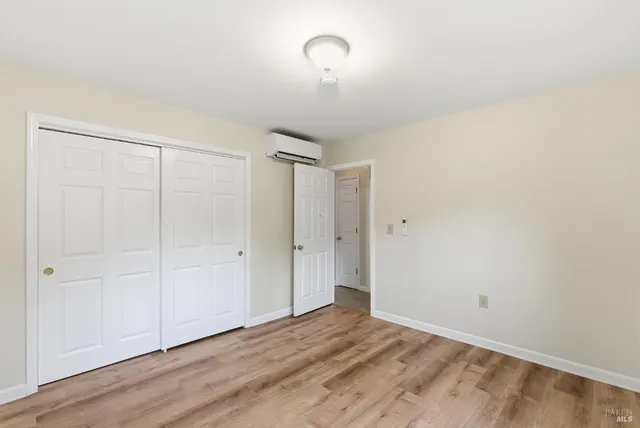 a view of a livingroom with wooden floor