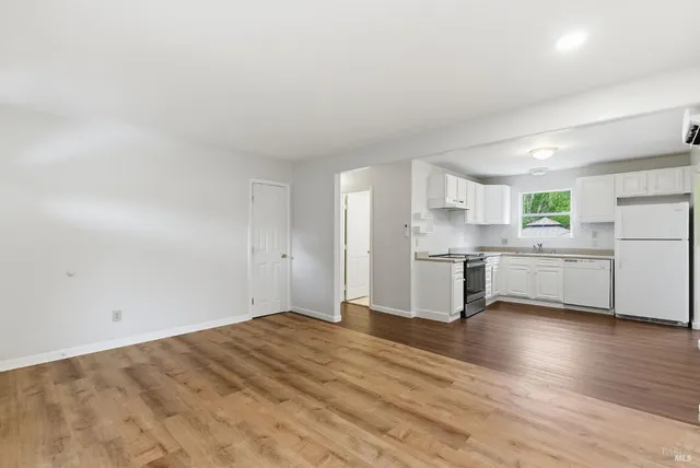 a view of kitchen with wooden floor