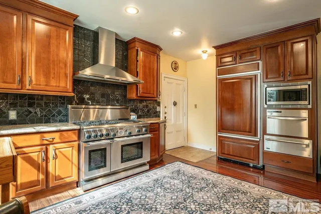 a bathroom with a sink a vanity and a mirror