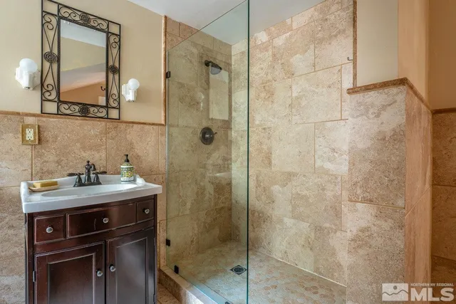 a view of a chair and table in backyard of the house