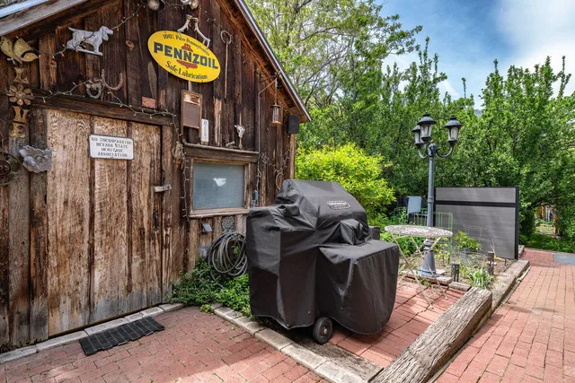 a view of a chairs and table on the wooden deck