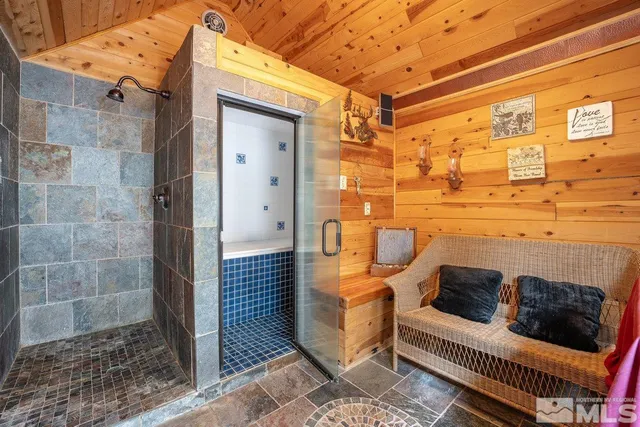 a view of a forest with mountains in the background