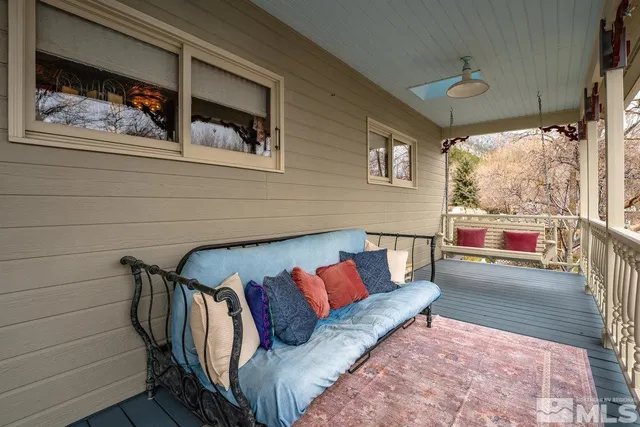a view of a porch with wooden floor