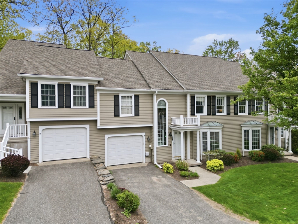 38 Shady Brook, Unit 38 West Springfield, MA 01089 - Photo 1 of 41 a front view of a house with garden and porch
