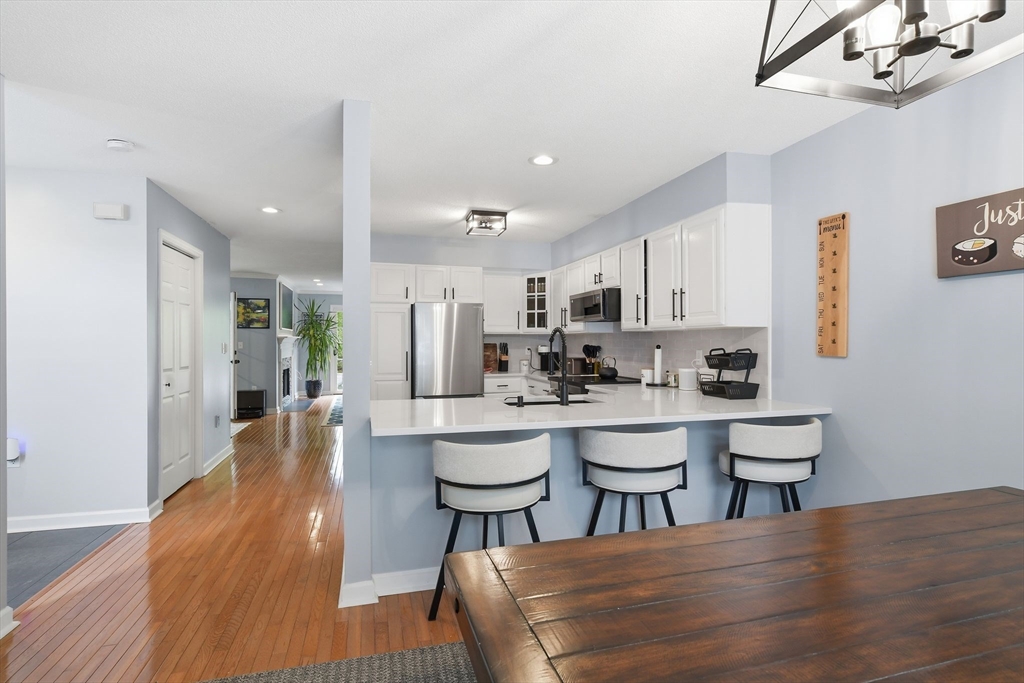 38 Shady Brook, Unit 38 West Springfield, MA 01089 - Photo 14 of 41 a large kitchen with a table and chairs