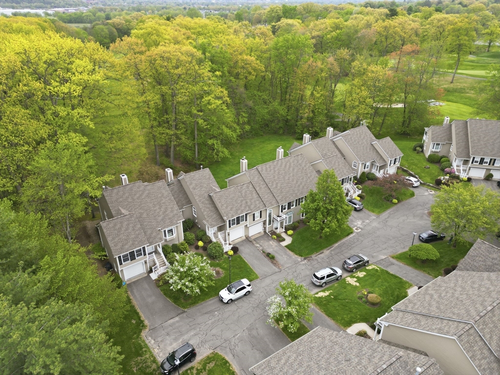 38 Shady Brook, Unit 38 West Springfield, MA 01089 - Photo 3 of 41 an aerial view of a house with a yard and lake view