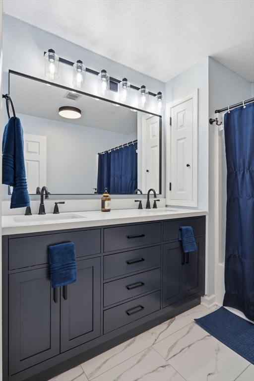 38 Shady Brook, Unit 38 West Springfield, MA 01089 - Photo 33 of 41 a bathroom with a sink double vanity and a mirror