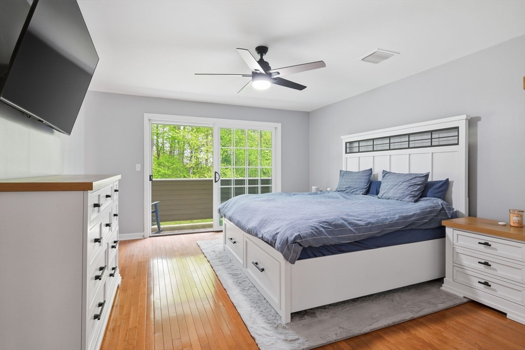 38 Shady Brook, Unit 38 West Springfield, MA 01089 - Photo 34 of 41 a spacious bedroom with a bed and a flat tv screen on dresser