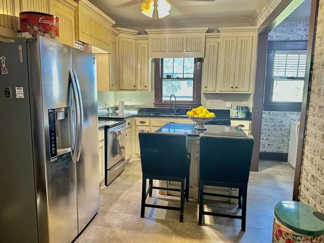 a bathroom with a sink a mirror and a shower