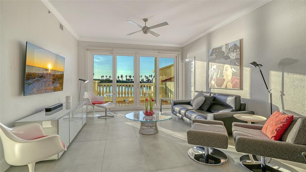 166 Golden Gate Point, Unit 22 Sarasota, FL 34236 - Photo 11 of 51 a living room with furniture and a large window