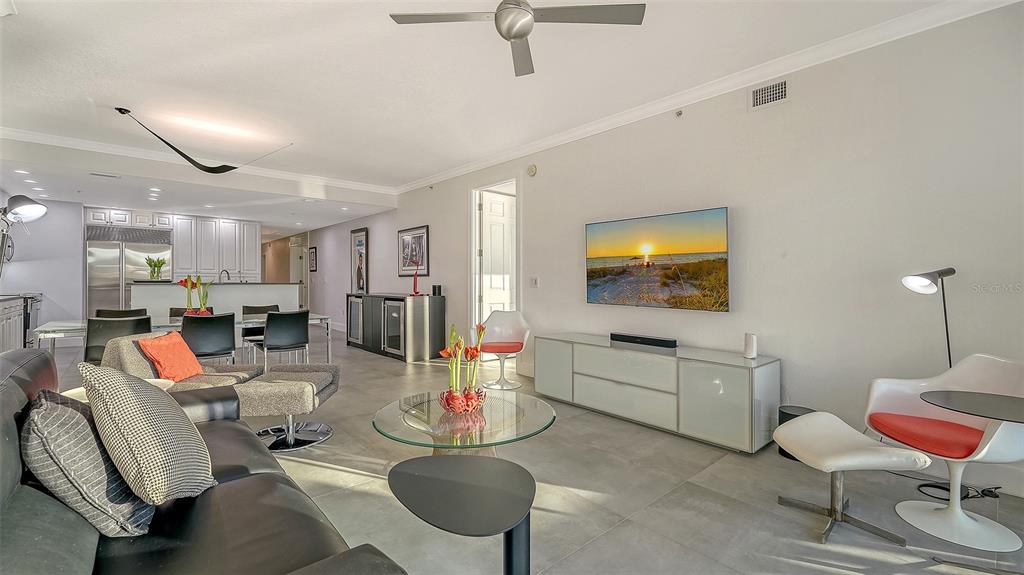 166 Golden Gate Point, Unit 22 Sarasota, FL 34236 - Photo 15 of 49 a living room with furniture and a flat screen tv