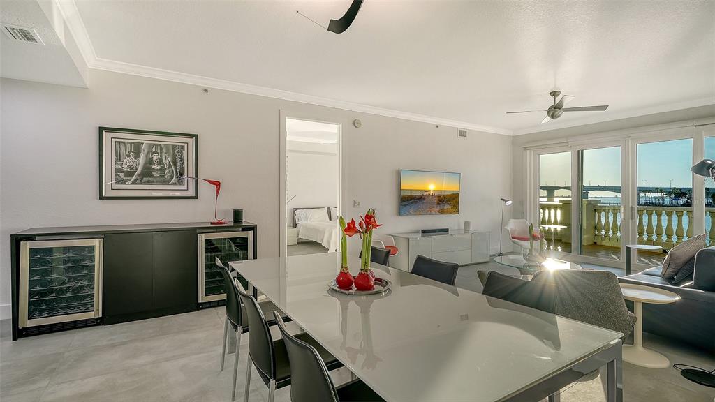 166 Golden Gate Point, Unit 22 Sarasota, FL 34236 - Photo 19 of 51 a view of a dining room with furniture window and wooden floor