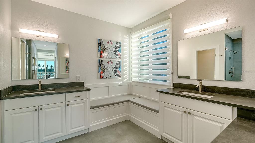 166 Golden Gate Point, Unit 22 Sarasota, FL 34236 - Photo 23 of 51 a bathroom with a sink and a mirror