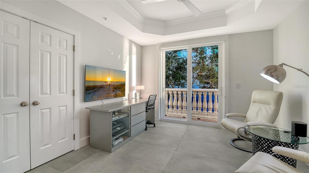 166 Golden Gate Point, Unit 22 Sarasota, FL 34236 - Photo 34 of 49 a bedroom with furniture and a window