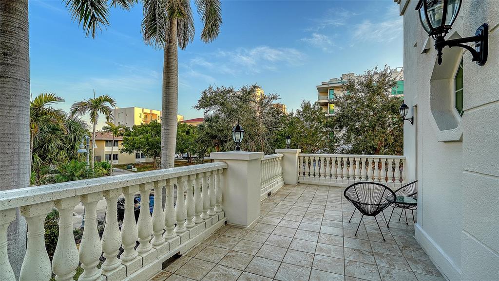 166 Golden Gate Point, Unit 22 Sarasota, FL 34236 - Photo 39 of 51 a view of a balcony with chairs