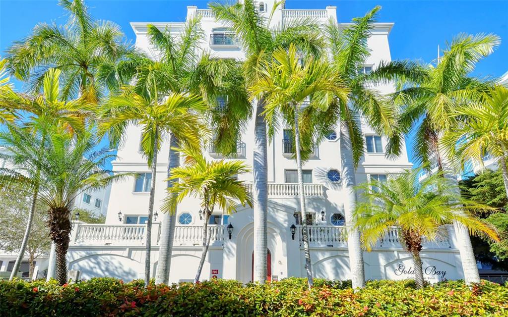 166 Golden Gate Point, Unit 22 Sarasota, FL 34236 - Photo 42 of 49 a view of multiple house with a palm tree