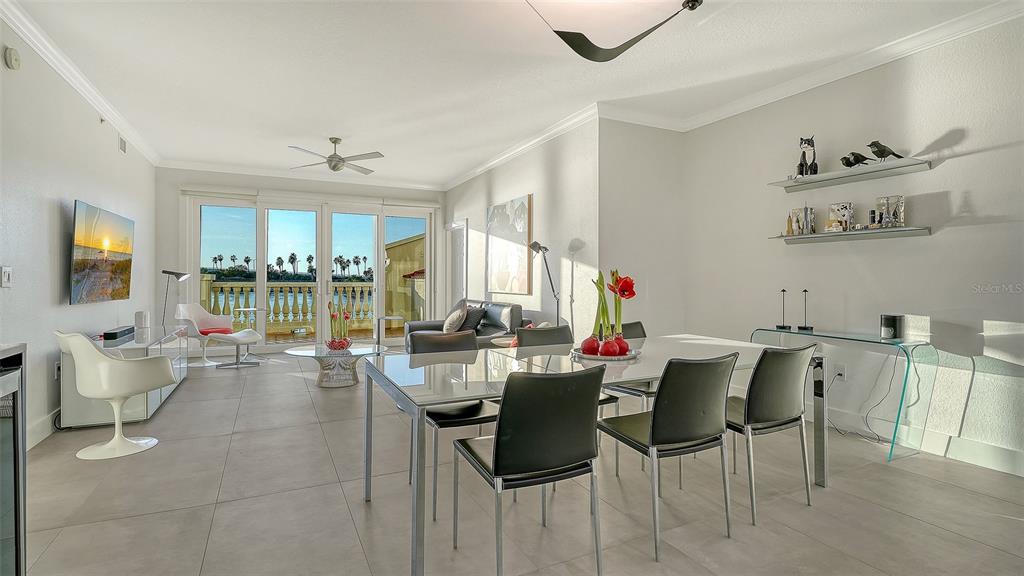166 Golden Gate Point, Unit 22 Sarasota, FL 34236 - Photo 10 of 49 a view of a dining room with furniture window and outside view