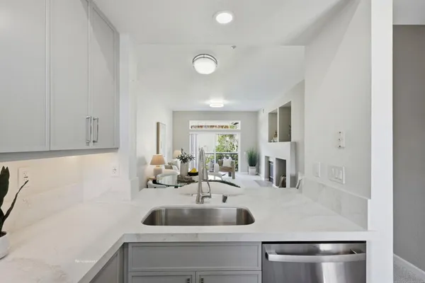 a kitchen with a white table and chair