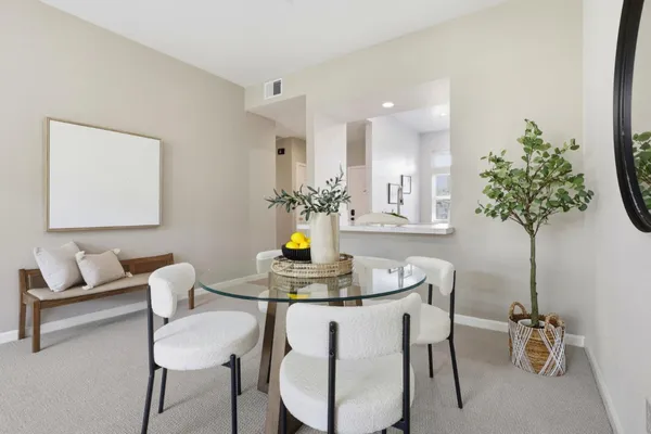 a view of a dining room with furniture window and outside view
