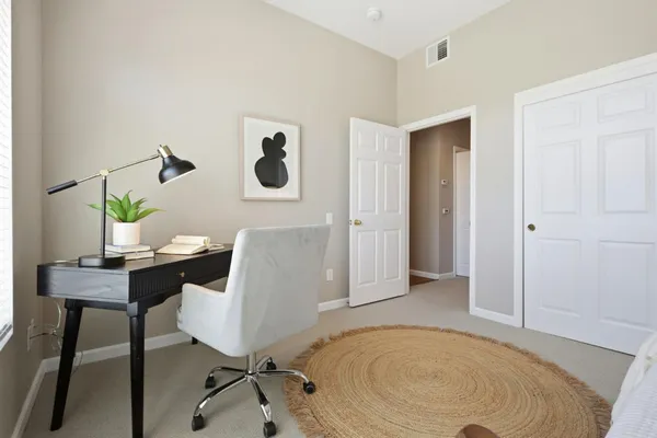 a en suite bathroom with a shower a sink and a mirror