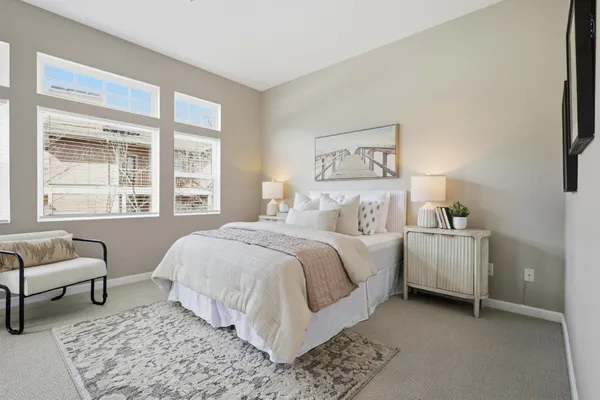 a bedroom with a bed and a table in it
