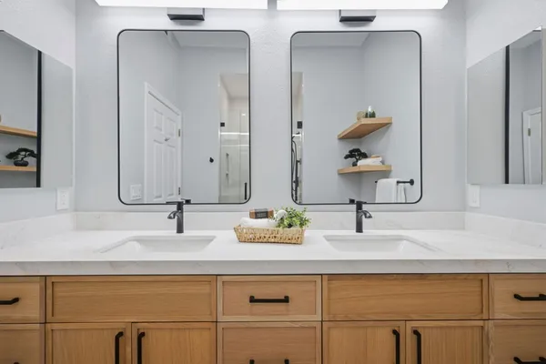 a bathroom with a shower toilet and sink