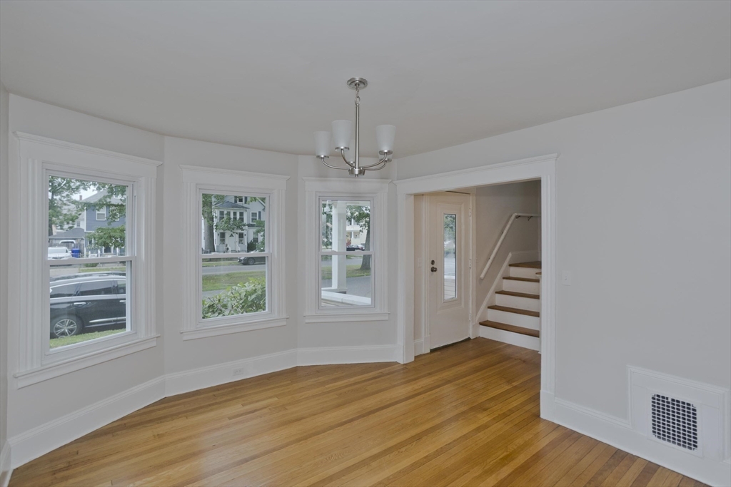 191 Phoenix Terrace Springfield, MA 01104 - Photo 8 of 34 a view of wooden floor and windows in a room