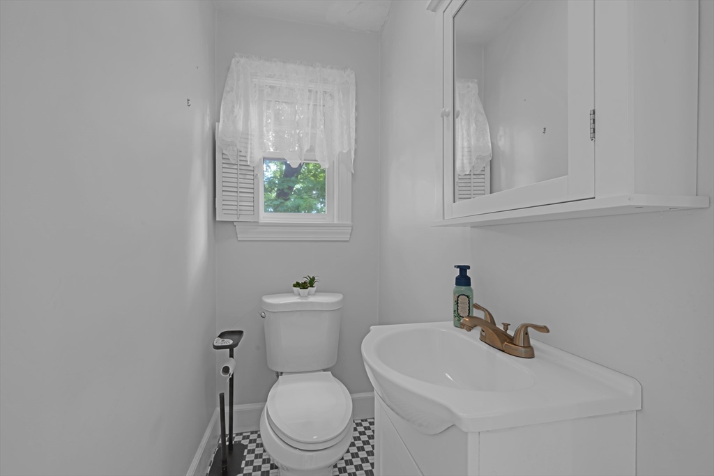 71 Morningside Road Worcester, MA 01602 - Photo 16 of 42 a bathroom with a toilet a sink and mirror