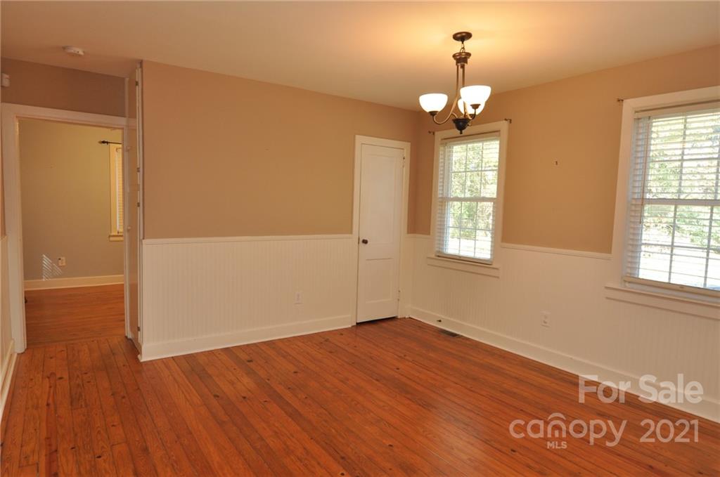 623 Sanders Street Chester, SC 29706 - Photo 13 of 20 wooden floor in an empty room with a window