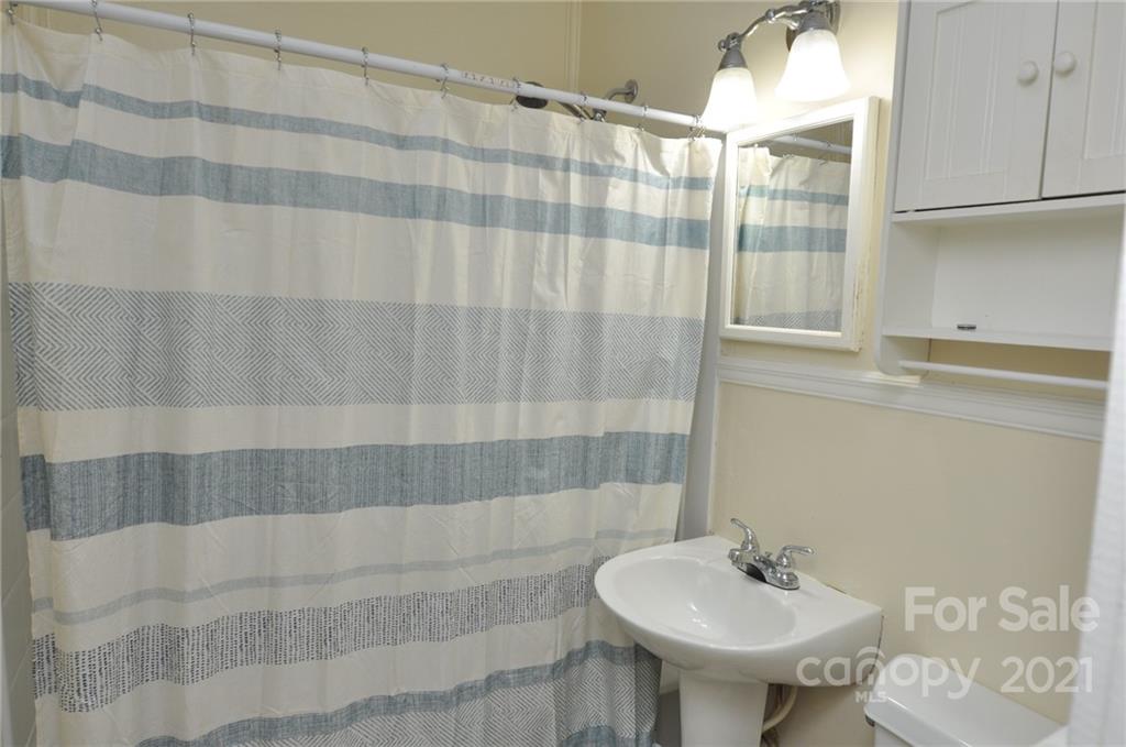 623 Sanders Street Chester, SC 29706 - Photo 9 of 20 a bathroom with a sink and a mirror