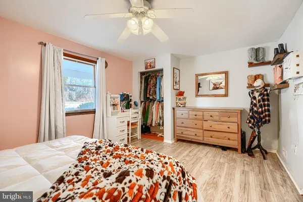 a bedroom with a bed and a dresser
