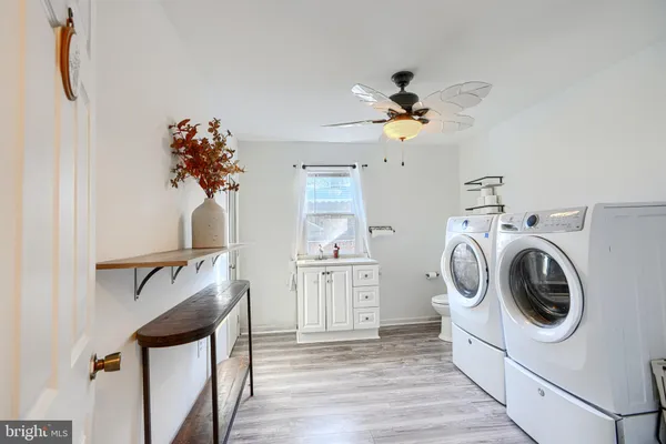 a view of a hallway with washer and dryer