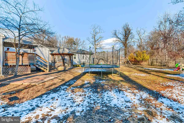 a view of a yard with swimming pool