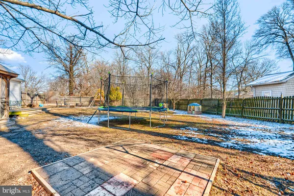 a view of yard with large trees