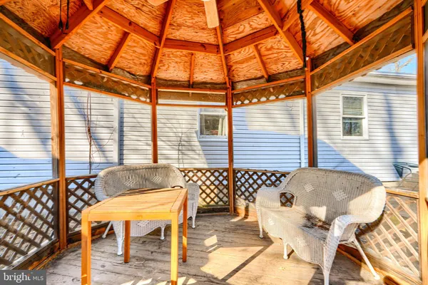 a outdoor space with a couch and chairs
