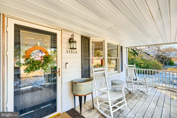 a balcony with table and chairs