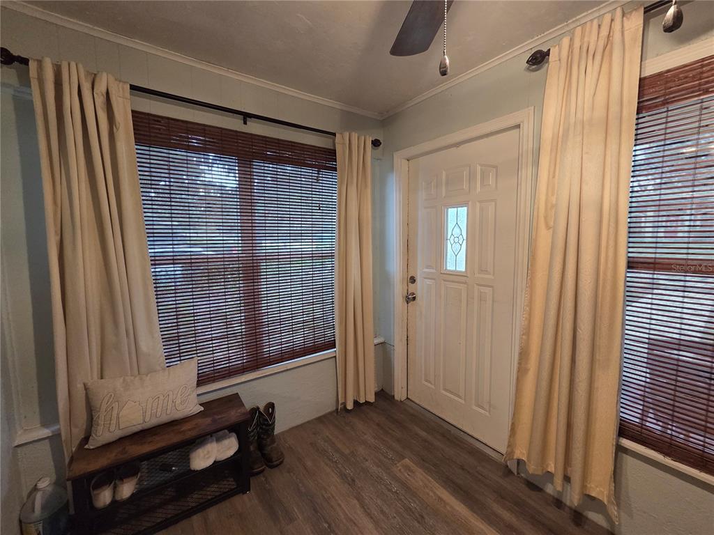 124 East F Street Frostproof, FL 33843 - Photo 6 of 37 a view of a room with wooden floor and windows