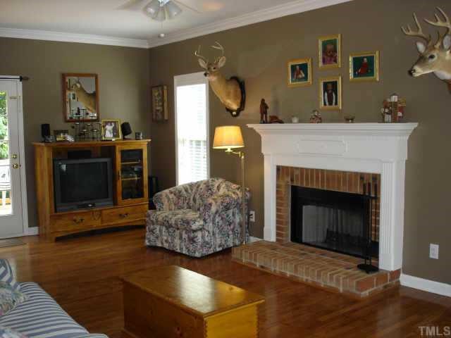 3521 Boren Court Raleigh, NC 27616 - Photo 2 of 10 a living room with furniture and a fireplace